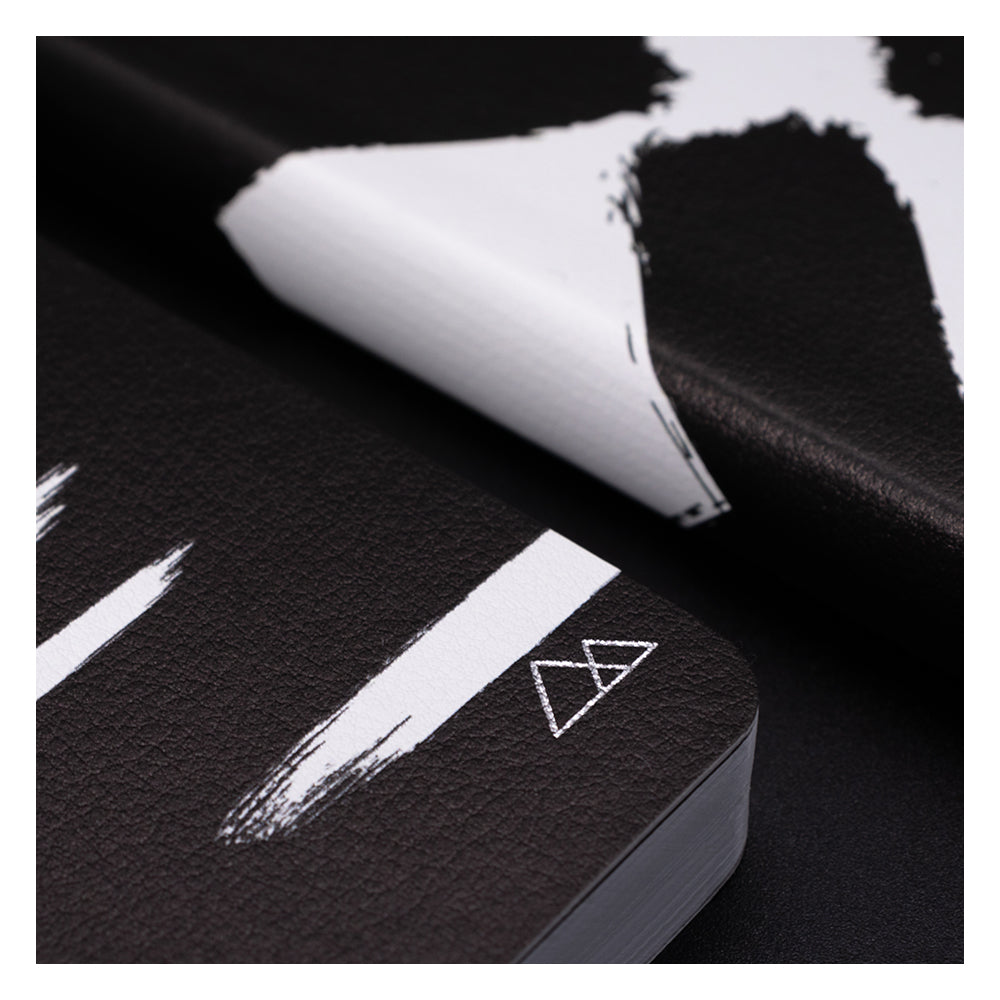 A close crop of two black and white Cargo Hills notebooks